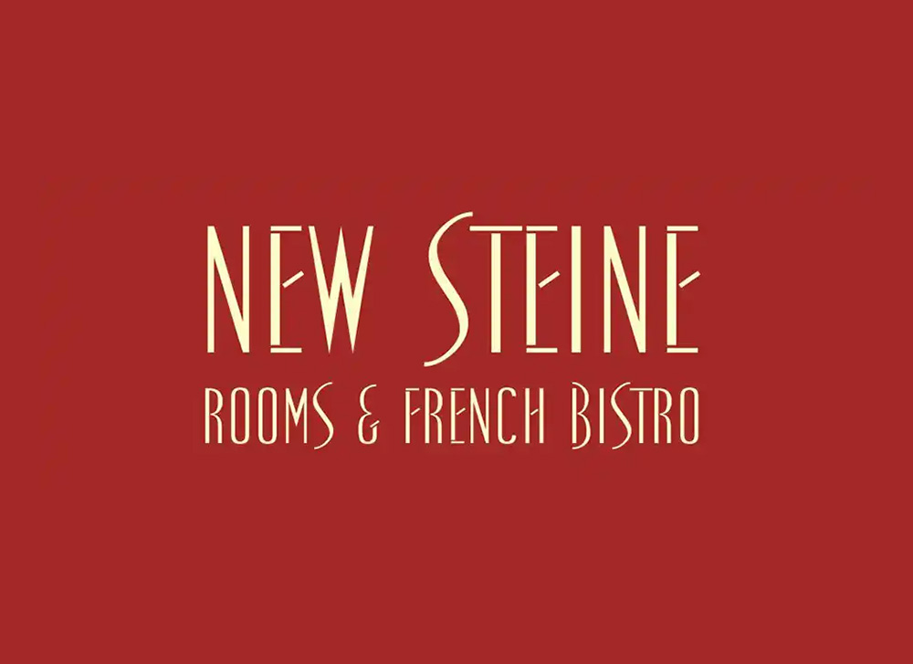 New Steine Hotel text over a red background.