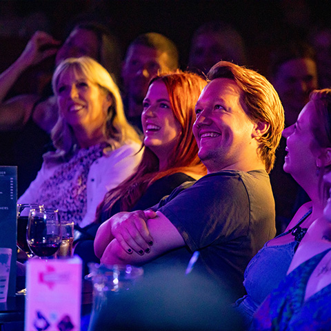 People laughing in a crowd
